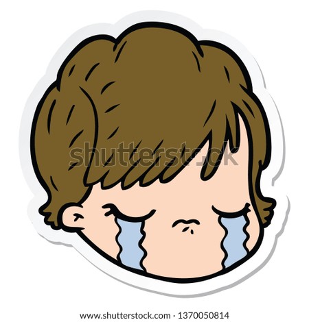 sticker of a cartoon female face crying