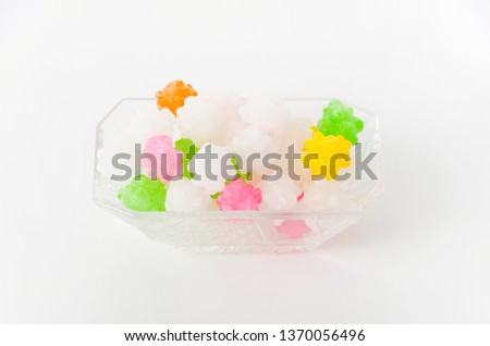 colorful konpeitou (japanese traditional sugar candy) in small glass bowl