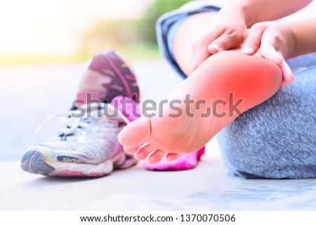 Heel pain and foot (plantar fasciitis).
Caused by exercise or running. Royalty-Free Stock Photo #1370070506