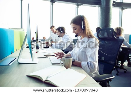 How can I help you? Female customer support operator with headset and smiling Royalty-Free Stock Photo #1370099048