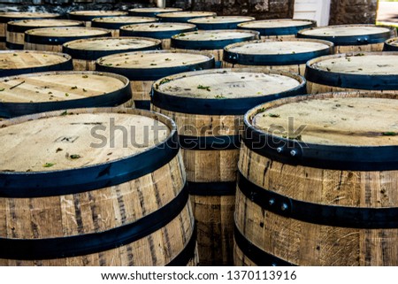 Bourbon oak barrels waiting to be filled at a Kentucky distillery along the bourbon trail.  Royalty-Free Stock Photo #1370113916