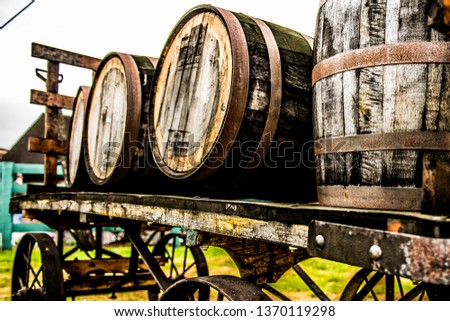 Rustic bourbon barrels on a wagon along the bourbon trail in Kentucky.  Royalty-Free Stock Photo #1370119298
