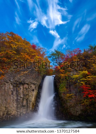 Beautiful autumn scenery in Japan, Asia. The fallen leaves make the stream a beautiful color picture 