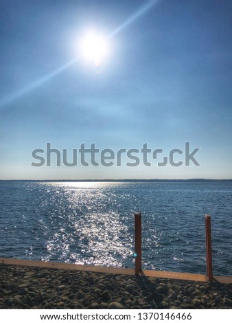 Lake Erie blue water and sunshine on a vivid summer afternoon - image