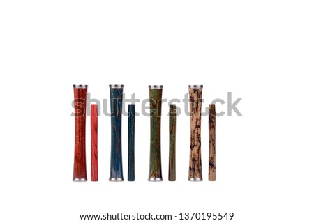 Wooden red, blue, green and brown, beige with burned-out elements of lightning hookah stems and mouthpiece details in a vertical position isolated on a white background.