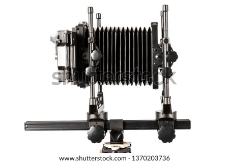 Horizontal shot of a view camera with bellows extended isolated on white with copy space.