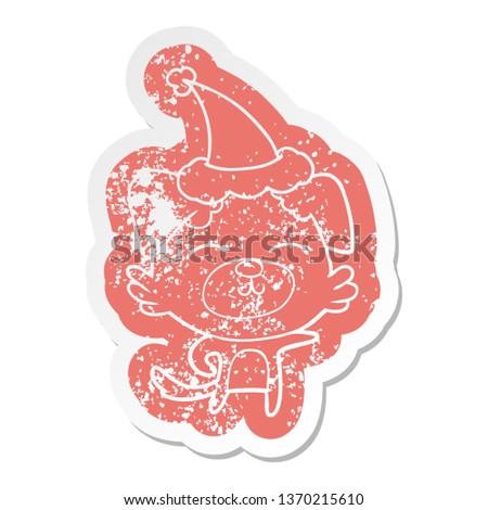 quirky cartoon distressed sticker of a dog pointing wearing santa hat