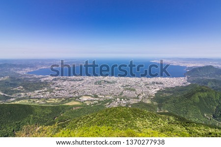 Panorama of Beppu City and Bay between Mountains of Kyushu and green Landscape in the foreground from Mount Tsurumi. Beppu, Oita Prefecture, Japan, Asia. Royalty-Free Stock Photo #1370277938