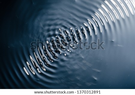 The texture of water under the influence of vibration in 432 hertz - image Royalty-Free Stock Photo #1370312891