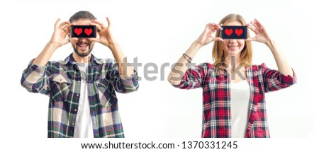 Date app. Couple in love. Man and woman is holding smartphone. Showing blank screen mobile phone with a heart sign the symbol of love. Closed eyes phone. Innovation technology.