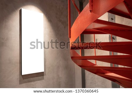 Spiral stairs and empty frame
