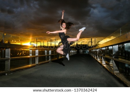 Ballerina dances on the bridge