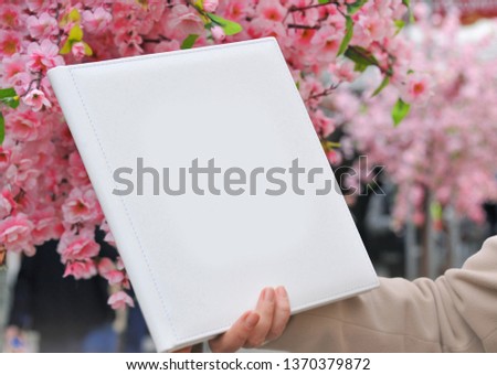 The expanded book on a flower background. Place for text