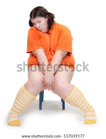 Obese school girl on a white background. Healthy lifestyle and nutrition concept.
