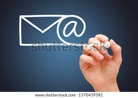 Hand drawing Email, internet communication, or newsletter concept with white marker on transparent wipe board on dark blue background.