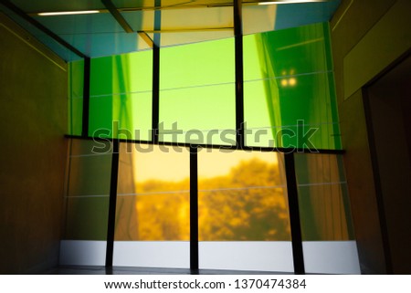 Colorful tall windows of modern building interior