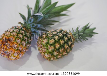 Selective focus on Pineapples on a white table