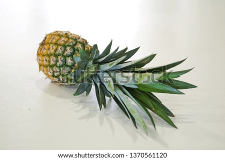 Selective focus on Pineapples on a white table