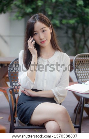 portrait of thai china adult office girl white shirt walk  and calling smart phone