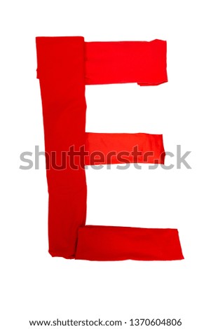 Letter E made of different colored cloth on a white background. Isolated