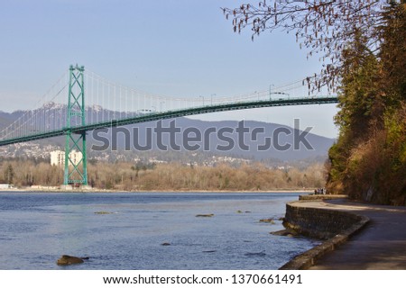 A view of the Lion's Gate Bridge in Vancouver, BC, Canada, as viewed from the Stanley Park seawall