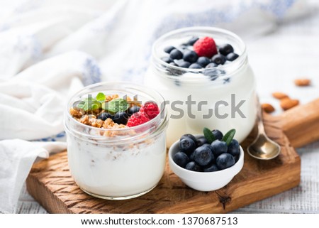 Natural Greek Yogurt With Fresh Berries And Granola In Jar. Healthy Eating, Healthy Lifestyle, Sporty Fitness Food Menu Concept Royalty-Free Stock Photo #1370687513