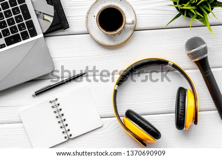 podcast record with laptop, coffee, notebook, microphone and headphones on white background top view space for text