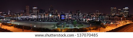 A four segment panorama of Baltimore's Inner Harbor skyline taken at night from Federal Hill.