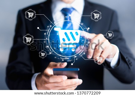 Shopping icon with businessman using mobile smartphone in background. Online shopping or e-commerce concepts.