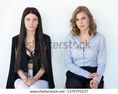 two beautiful female candidates waiting for job interview