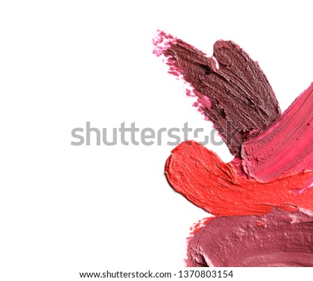 Lipstick smears isolated on white, top view. Space for text