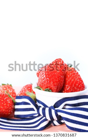 strawberries and striped ribbon