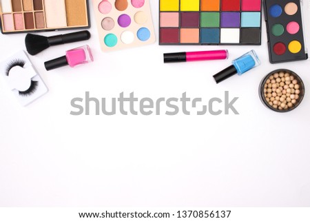 Make up and beauty products on the top of the white background 