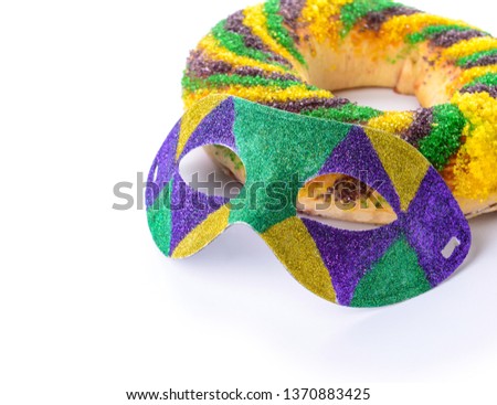 Festive cake for Mardi Gras (Fat Tuesday) holiday with mask on white background