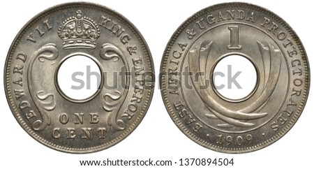 British East Africa and Uganda Protectorates coin 1 one cent 1911, title of King Edward VII around center hole, crown above, crossed tusks, date below, Royalty-Free Stock Photo #1370894504