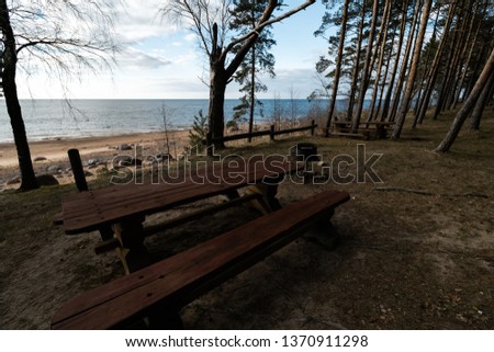 Beautiful distant picnic and camping spot Veczemju Klintis near a Baltic sea in a pine forest with a boulder beach in the background - 2019