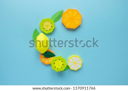 The letter C, lined from paper fruits. Vitamin concept