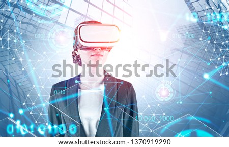 Businesswoman in virtual reality headset over cityscape background with network hologram and binary code. Immersive HUD interface. Concept of computer engineering. Toned image double exposure
