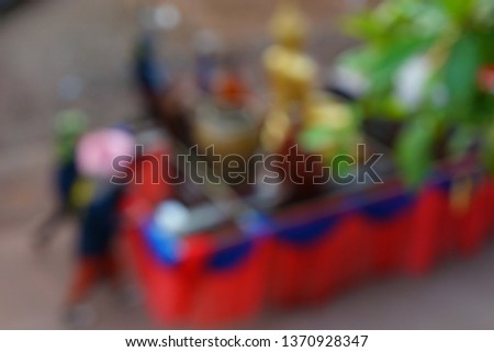 The parade of Songkran day by intentionally shooting the picture is unclear and selective focus 