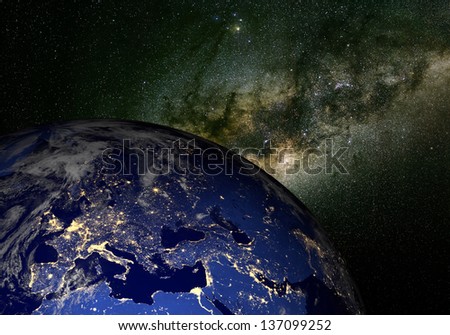 The Earth from space at night and the Milky Way. Elements of this image furnished by NASA. Other orientations available.