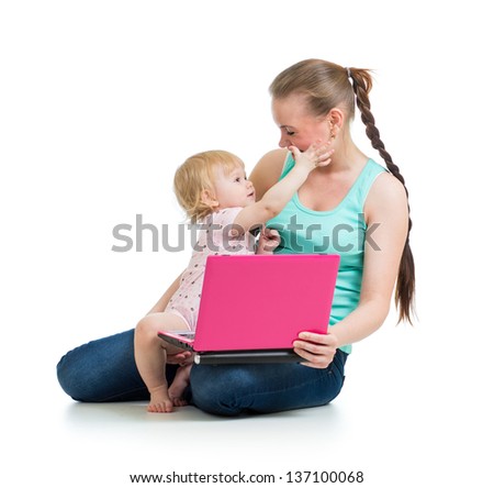 mother and child working at laptop