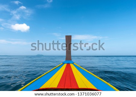 Colorful forward ship of long tail boat, taxi boat, with seascape and blue sky background, The bow of the traditional long-tail boat at Andaman sea, Phuket Thailand