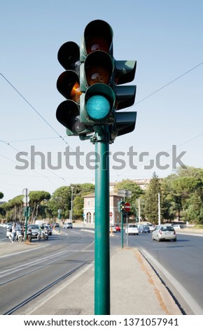 Traffic light standing on the road