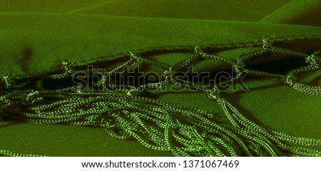 Background texture of silk fabric. This is a natural green salad scarf, this beautiful nylon satin made of artificial silk with a transparent hand and a wonderful sheen is perfect for your projects.