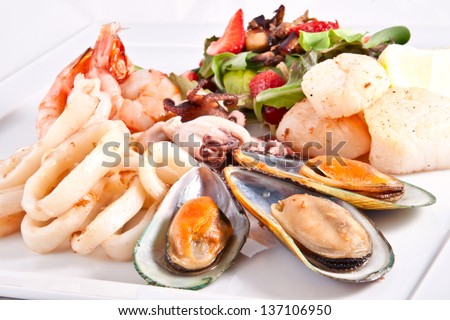 Seafood and salad Royalty-Free Stock Photo #137106950