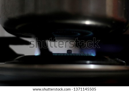 a blurred view of blue color flame of gas.