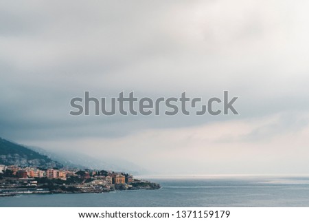 Scenic Mediterranean riviera coast. Panoramic view of Genoa town in Liguria, Italy. Film toned pic.