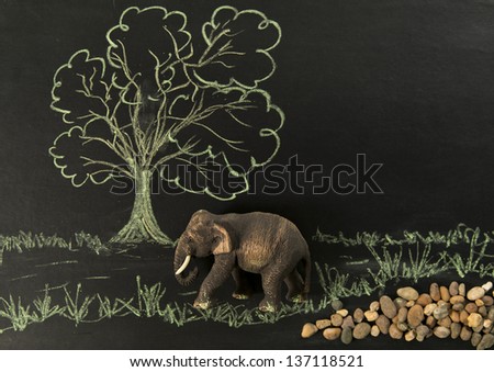 one wooden elephant walk along the forest scene