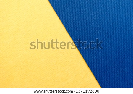 Blue and yellow paper texture background. Place for text. Two tones.