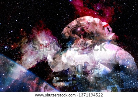Astronaut in deep space. Cosmic art. Elements of this image furnished by NASA